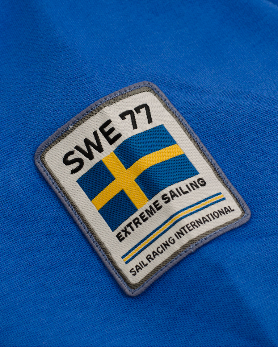 Heren | Truien | Sail Racing | International Zip Hood Sweden Punk Royal