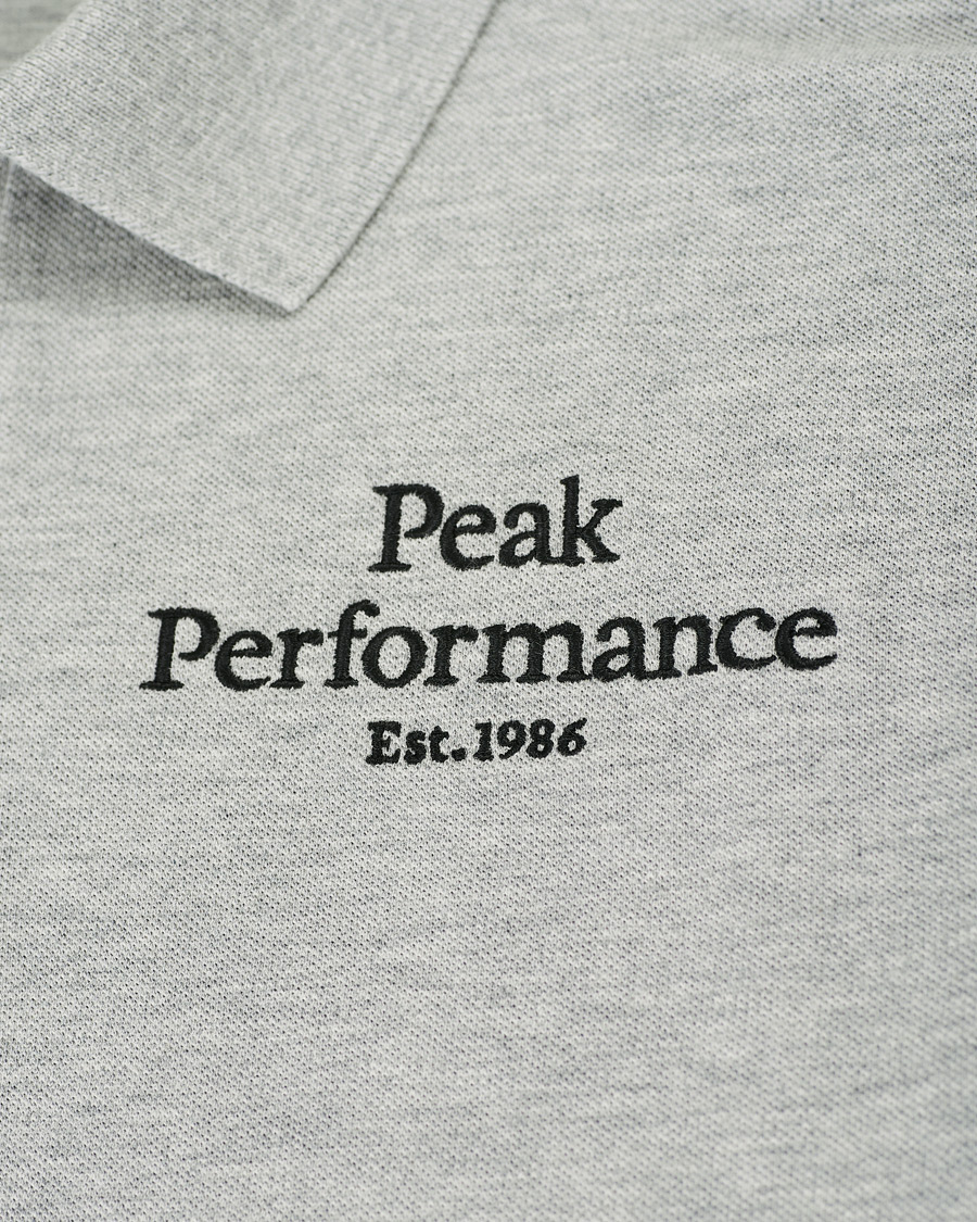 Heren | Polo's | Peak Performance | Original Logo Polo Medium Grey Heather