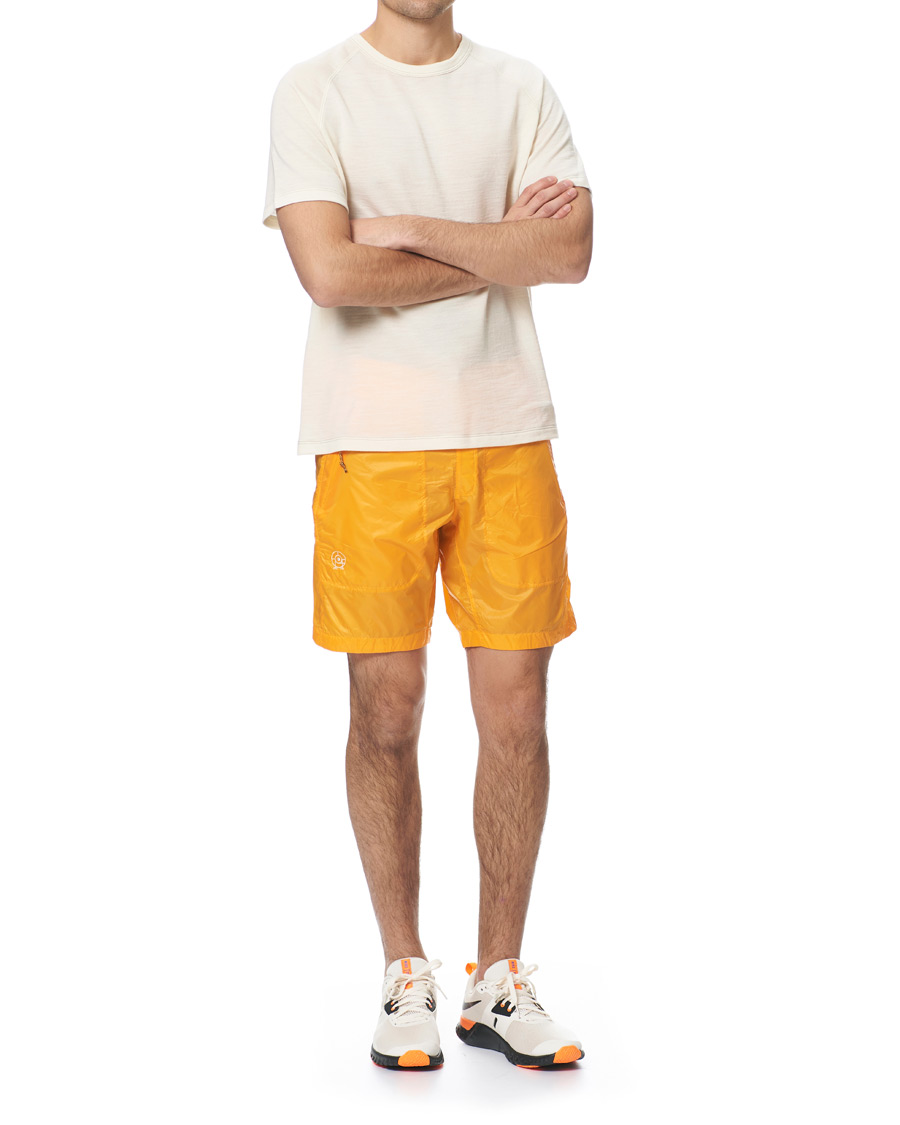 Heren | Korte broek | Peak Performance | Ben Gorham Windbreaker Shorts Orange