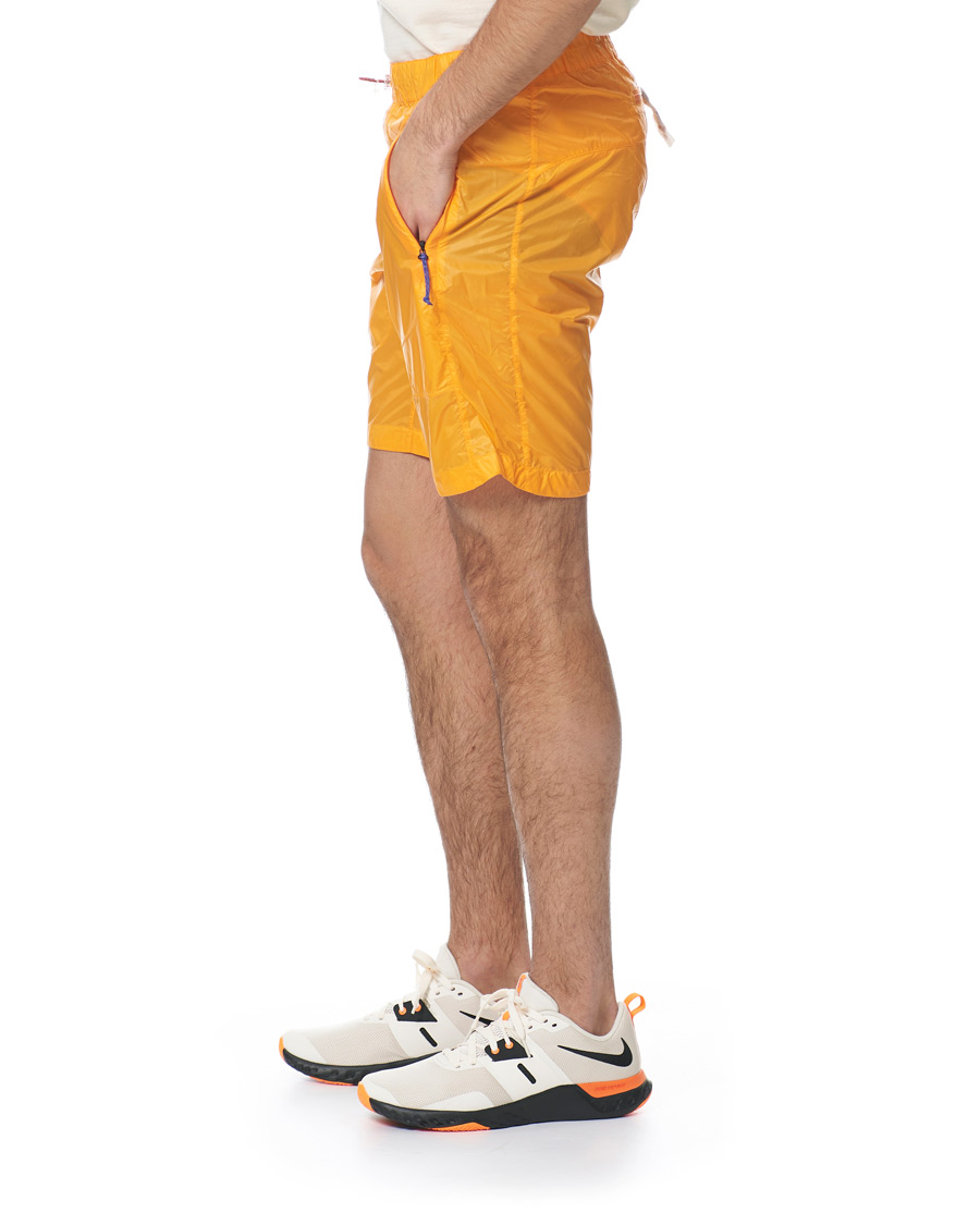 Heren | Korte broek | Peak Performance | Ben Gorham Windbreaker Shorts Orange