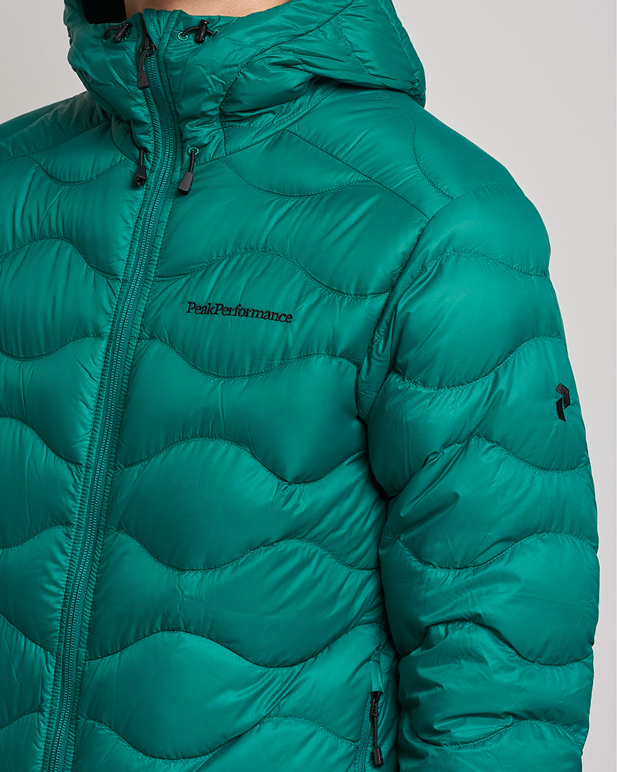 Heren | Jassen | Peak Performance | Helium Down Hood Green Ivy