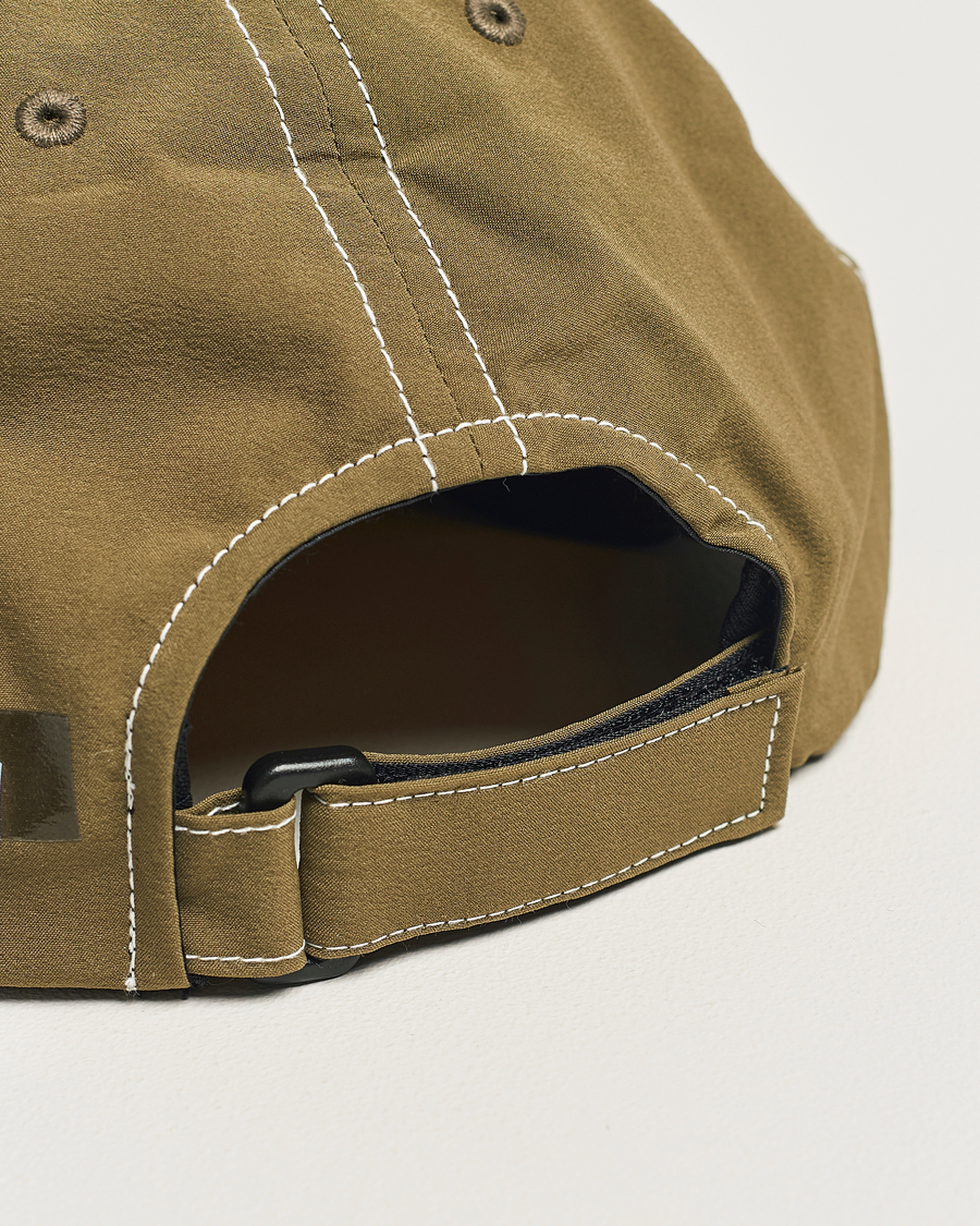 Heren | Satisfy PeaceShell Running Cap Oil Green | Satisfy | PeaceShell Running Cap Oil Green