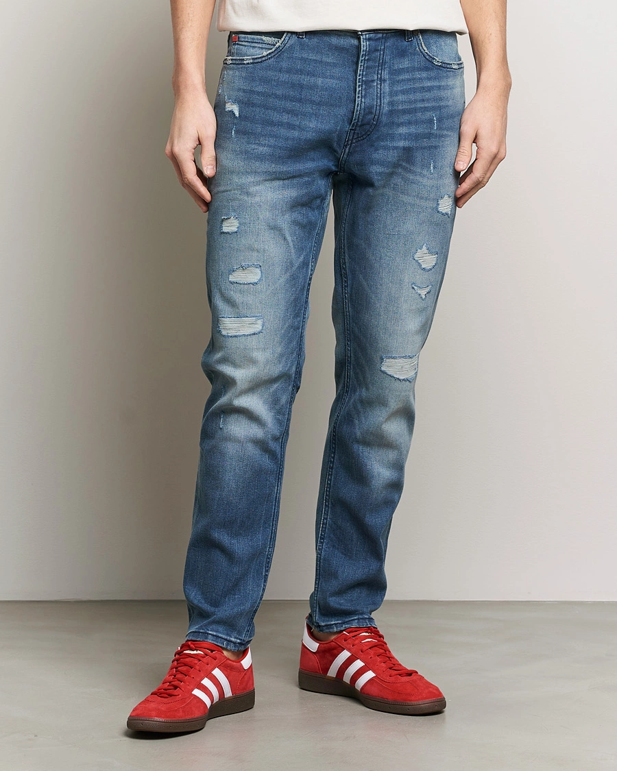 Heren | Blauwe jeans | HUGO | 634 Tapered Fit Stretch Jeans Bright Blue