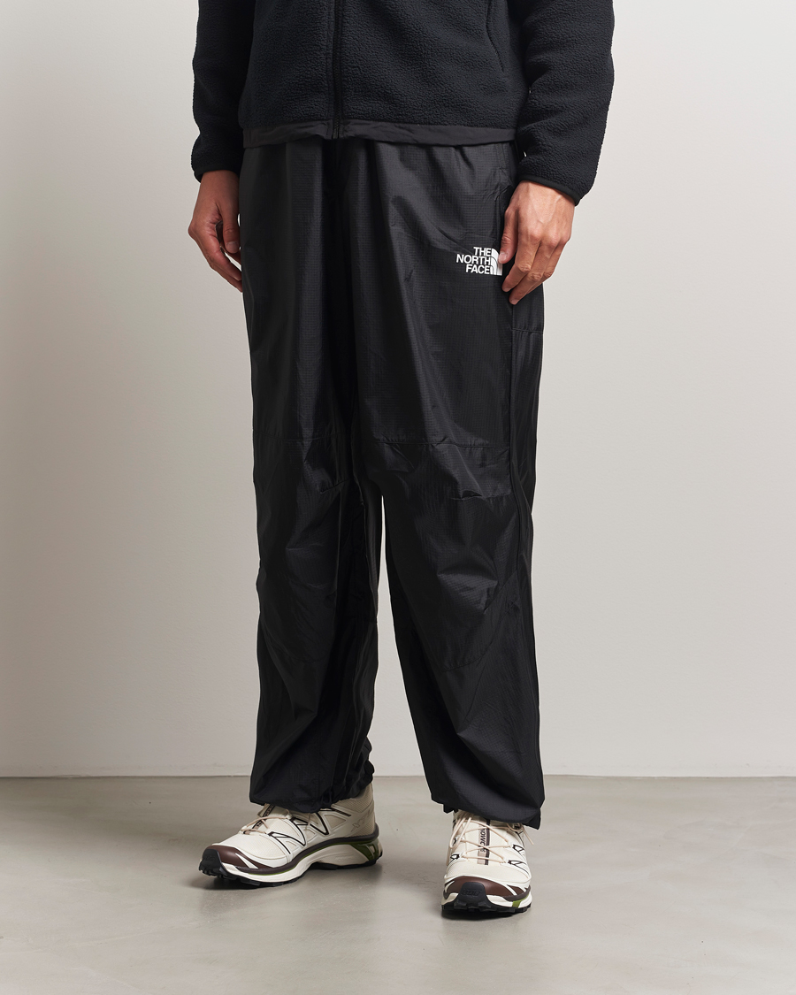 Heren | Broeken | The North Face | NSE Wind Track Pants Black