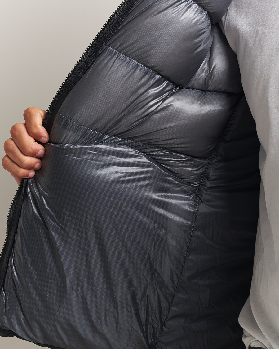 Heren | Jassen | Peak Performance | Helium Diamond Fused Hooded Down Jacket Black/Antarctica